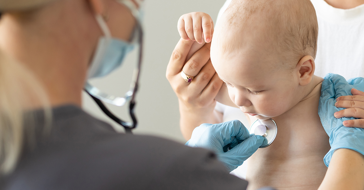 Family nurse practitioner examining a baby